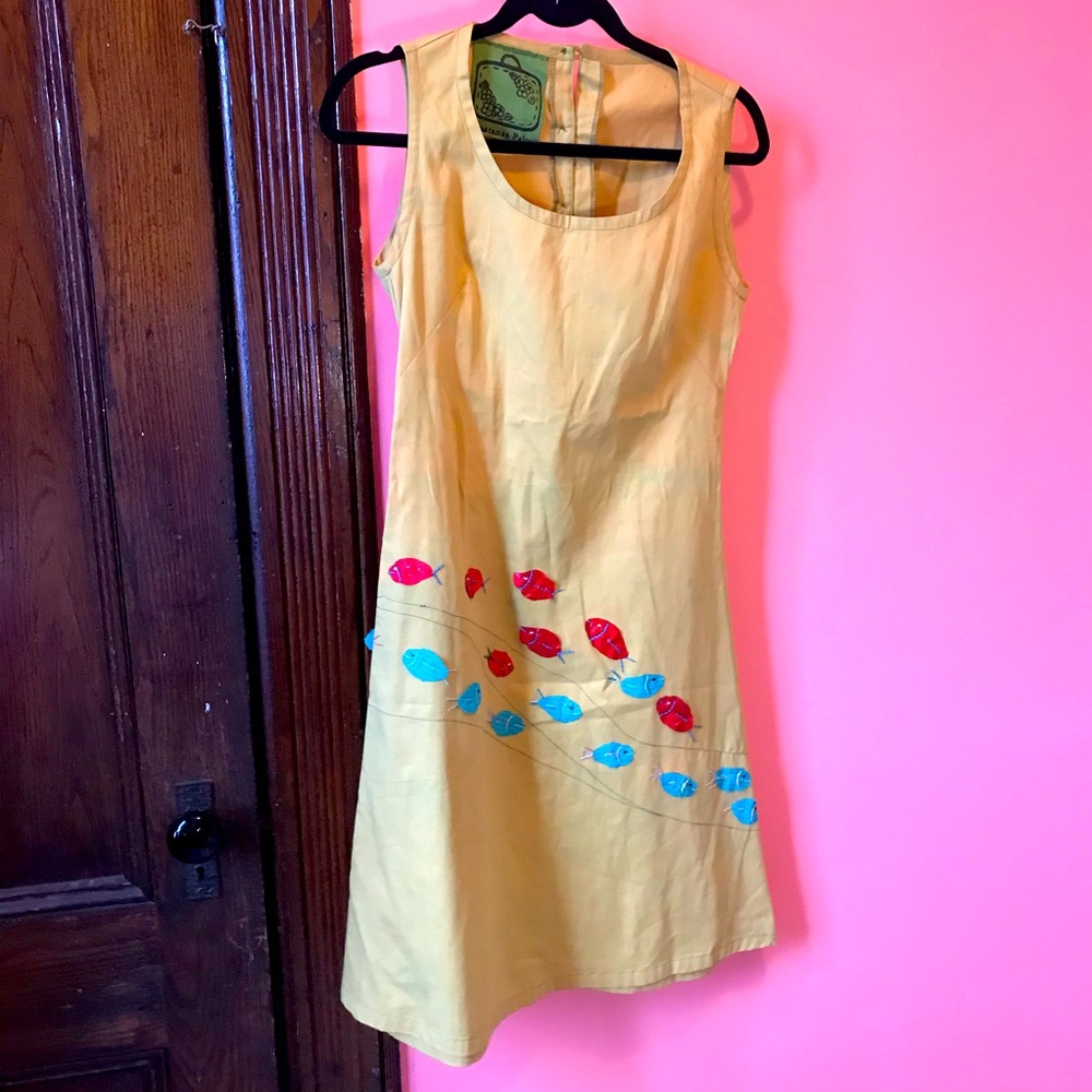 Cute green dress with fabric fish sewn on, sexy back buttons